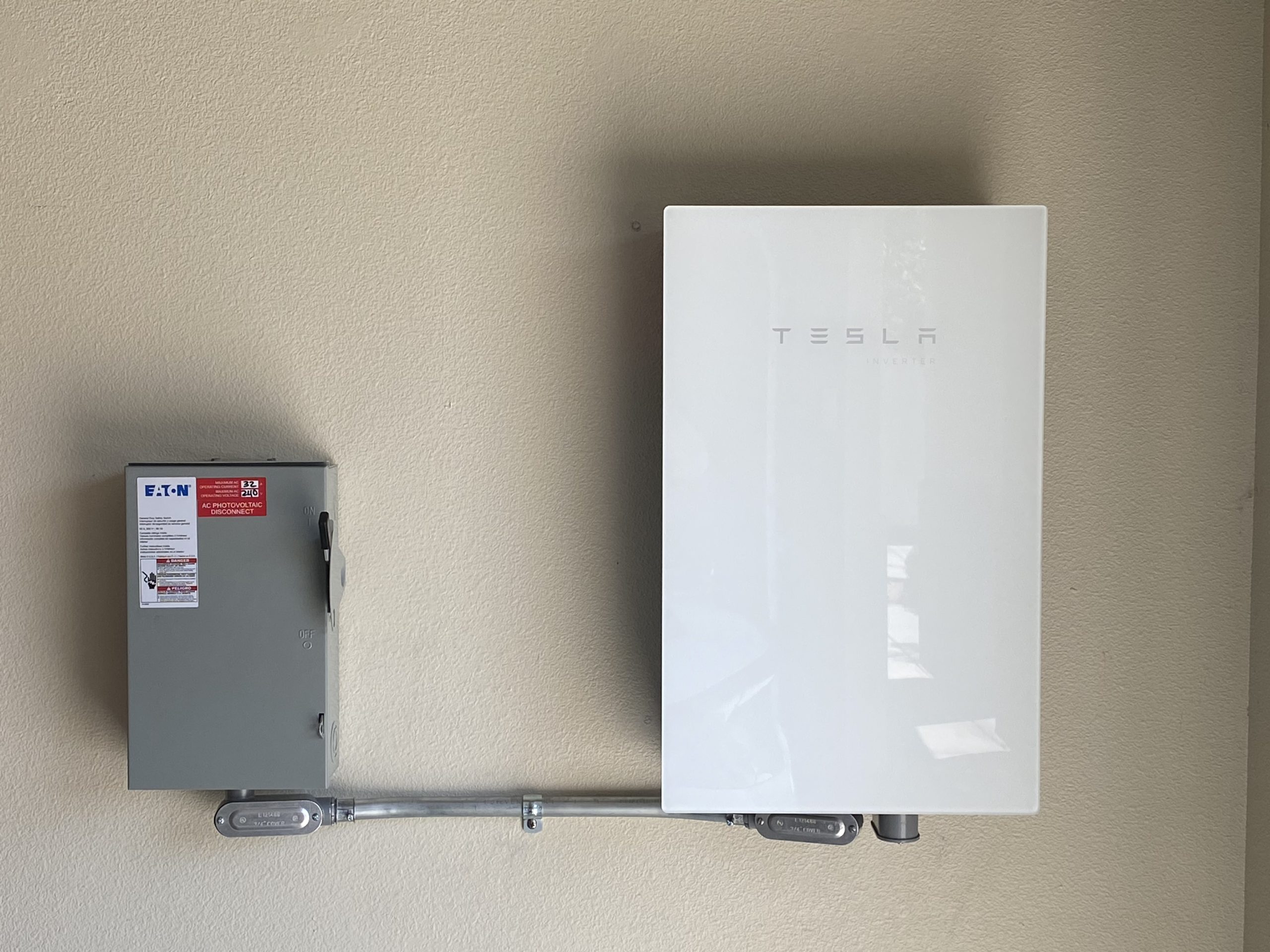 Solar inverter installed alongside an AC disconnect switch